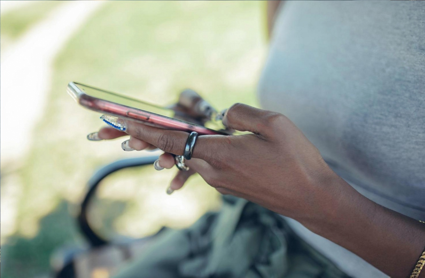 Detailed nail art technique being demonstrated with precision tools during a live broadcast
